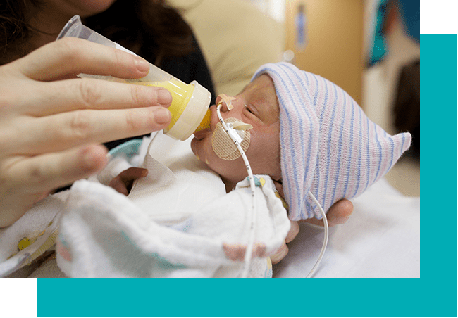 Baby drinking milk bottle