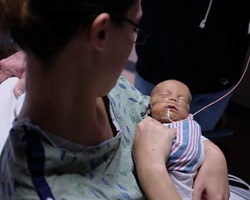 Stephanie holds her son, Ethan