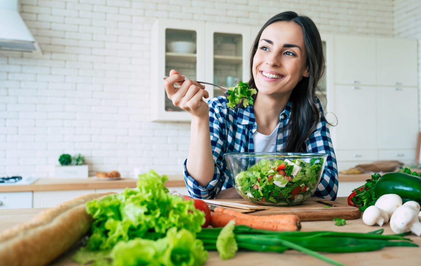 Woman eating salad