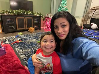 University Health pediatric transplant patient Oshae with mom in their home