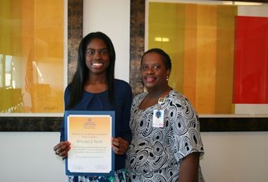 Dr. Brianna Scott receiving her scholarship