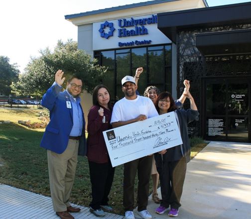 Group standing outside of University Health Clinic