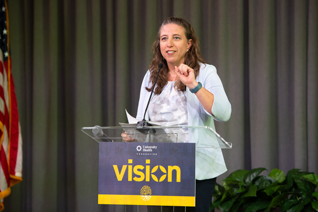 Sara M. Alger, president of University Health's Foundation team speaking at the Vision Luncheon