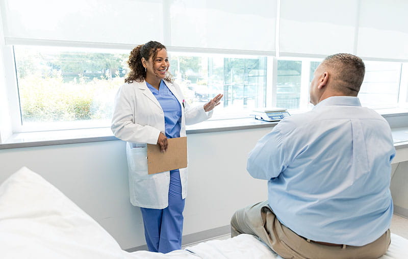 Female provider explaining procedure options to patient.