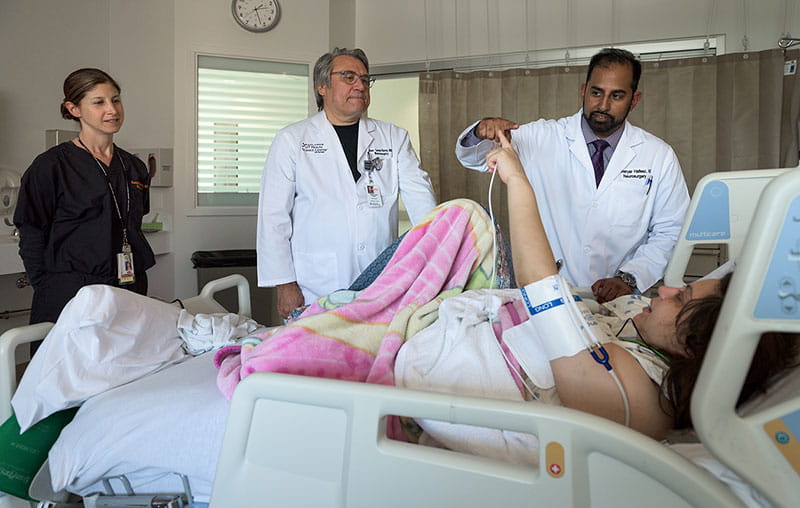 Stroke specialists with University Health performing examination of a stroke patient. 