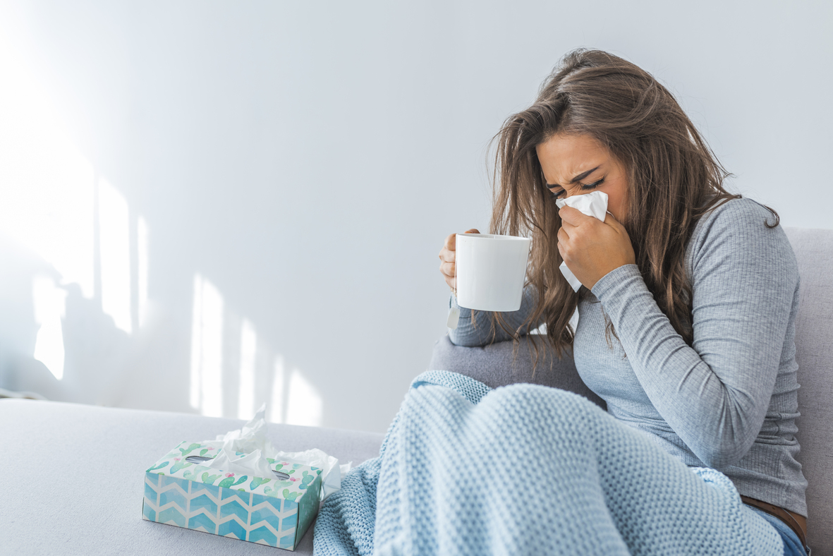 woman blowing nose